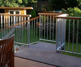 Galvanised tube with wooden handrail