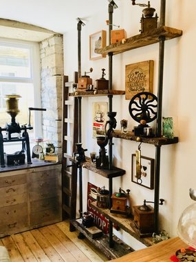 Blackened tube clamp coffee shop shelving