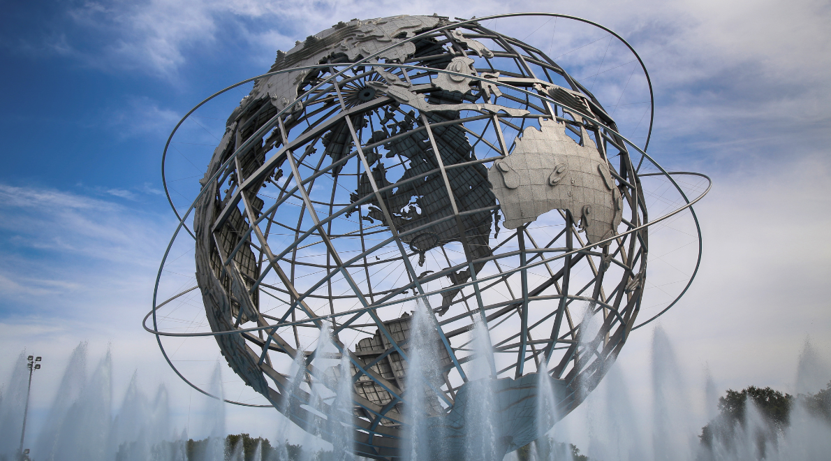 Captivating image of the Unisphere - A symbol of global unity and progress. The massive stainless steel globe takes center stage, surrounded by flowing fountains, inviting reflection on the interconnectedness of our world and the aspirations that transcend boundaries